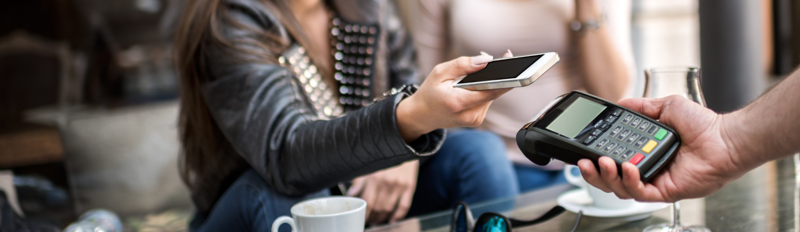 lady using her phone to make a payment