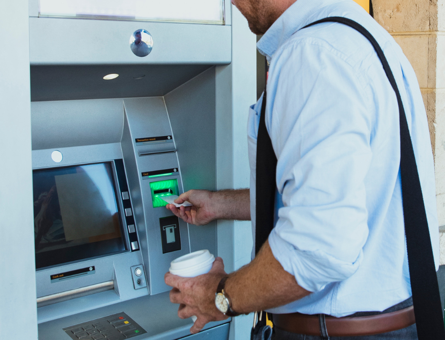 man using an atm